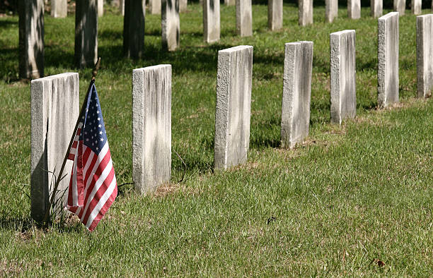 istock Row of Civil War Headstones with a single flag 92541635