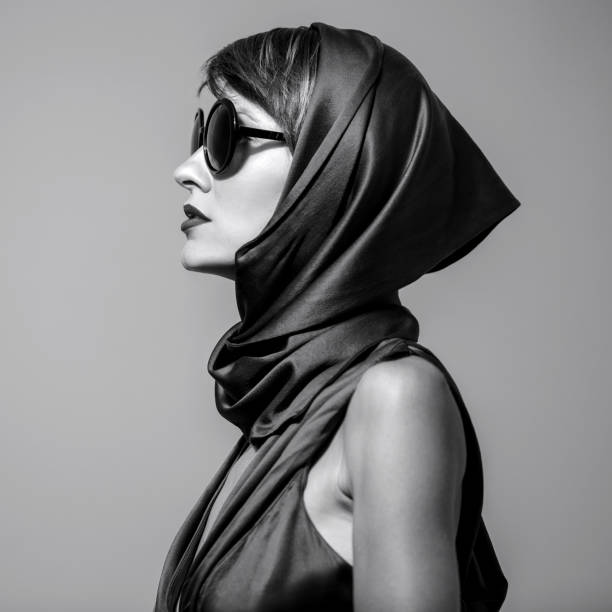 Fashion model girl in fashionable clothes Fashion model girl in fashionable clothes wearing sunglasses and head scarf. Black and white scarf photos stock pictures, royalty-free photos & images