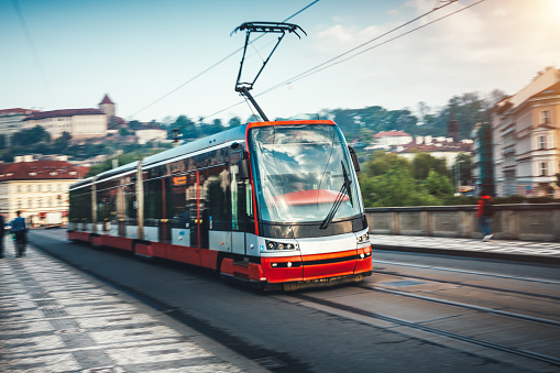 Red modern tram in Prague, Czech Republic.