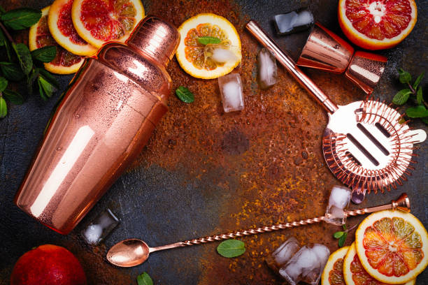 istock Bar accessories, drink tools and cocktail ingredients on rusty stone table. Flat lay style 925435320