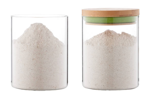 flour in glass container isolated on white background stock photo