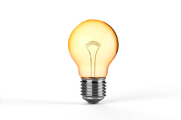 Yellow Incandescent Light Bulb - isolated stock photo