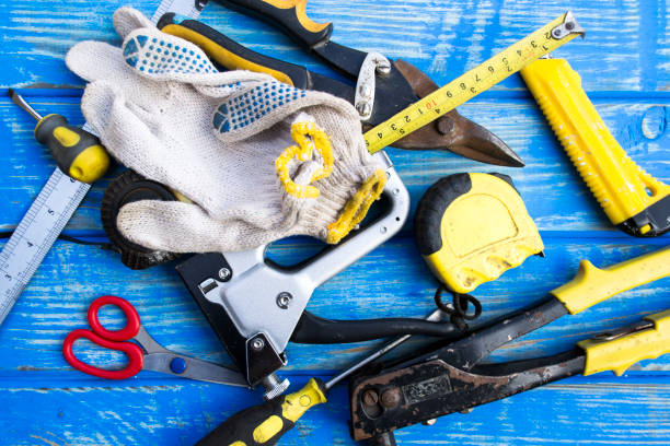 istock Old tools for repair on a blue wooden table. 925436706