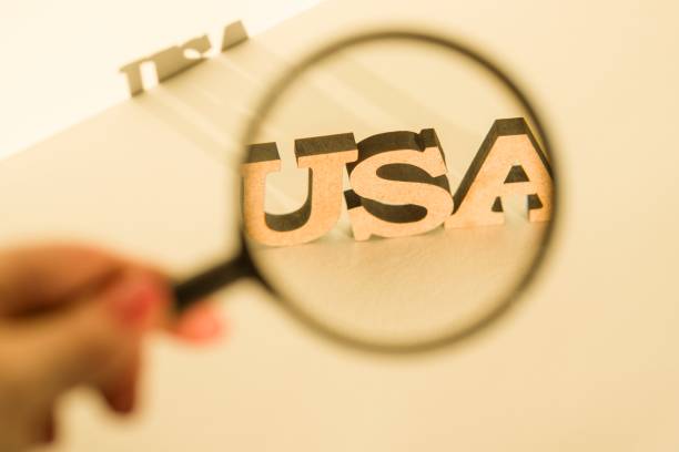 istock Magnifying glass on a white background with the word USA 925439214