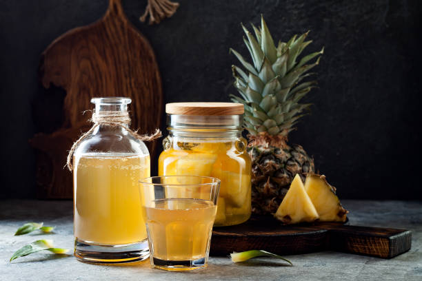 Fermented mexican pineapple Tepache. Homemade raw kombucha tea with pineapple. Healthy natural probiotic flavored drink. stock photo