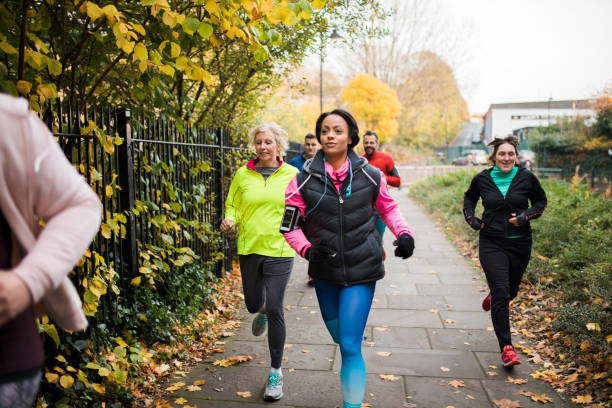 istock Group Of Friends Running Together 925446778