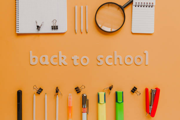 istock Back to school wooden lettering on an orange board. 925449928