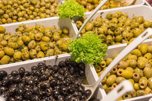 istock Mediterranean olives and olive paste on a street market 925465518