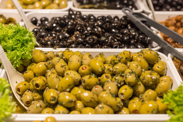 istock Mediterranean olives and olive paste on a street market 925465612