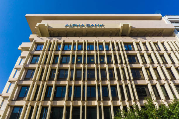 alpha bank building in athens, greece - eurozone debt crisis imagens e fotografias de stock