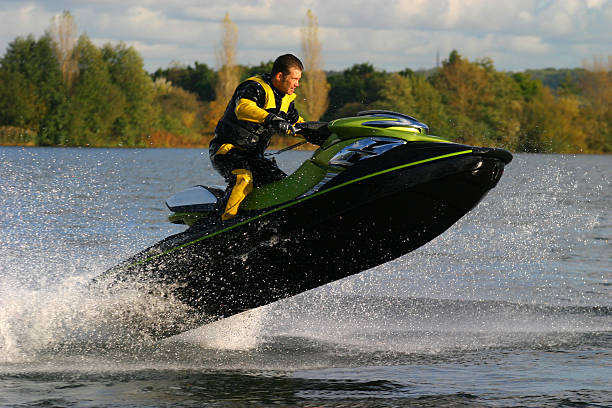Man Riding Jet Ski Wet Bike Personal Watercraft stock photo