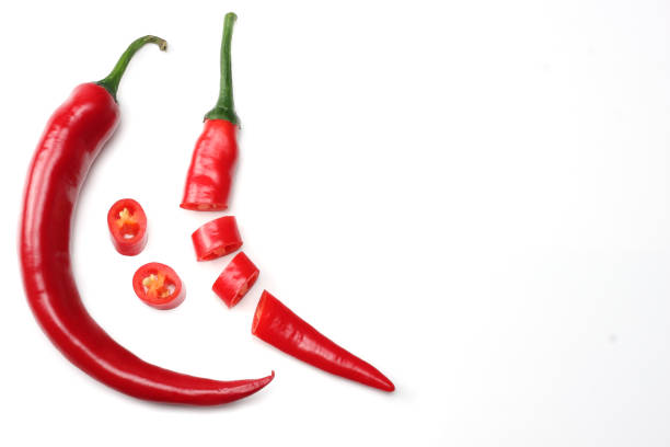istock sliced red hot chili peppers isolated on white background top view 925470508