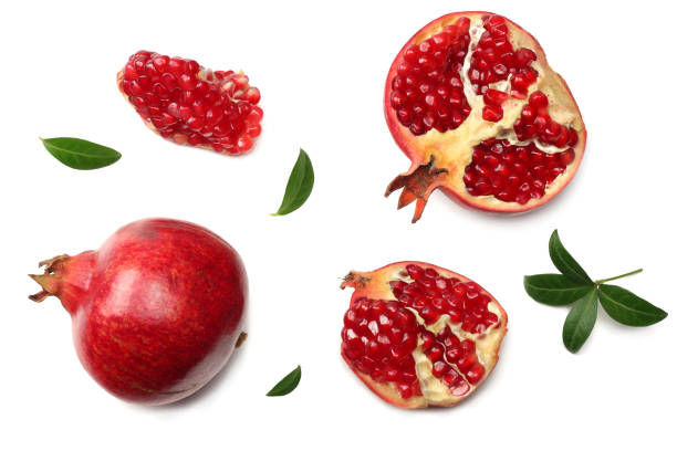 istock pomegranate fruit with green leaves isolated on a white background top view 925470604