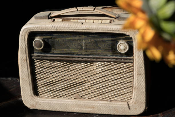 istock Wooden old retro radio over black background 925470778