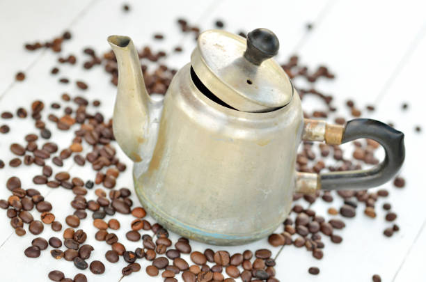 Young woman preparing Turkish coffee in the kitchen