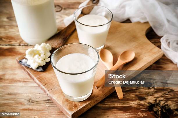 Kefir Grains In Wooden Spoon With Glass Of Kefir Stock Photo - Download Image Now - Kefir, Probiotic, Milk