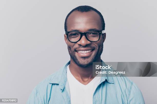 Close Up Portrait Of Confident Handsome Clever Cheerful Joyful University Professor Wearing Casual Denim Jeans Shirt And Black Rimglasses Isolated On Gray Background Stock Photo - Download Image Now