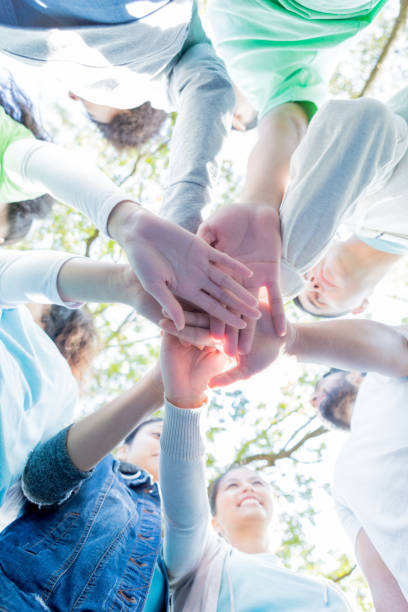 istock Neighbors are unified during community cleanup event 925477036