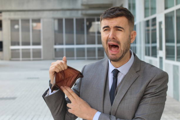 istock Businessman crying holding his empty wallet 925481520