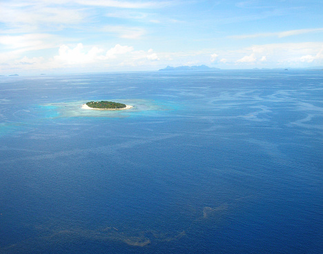 Luxurious blue waters around the Fiji islands, as seen from a sea plane.