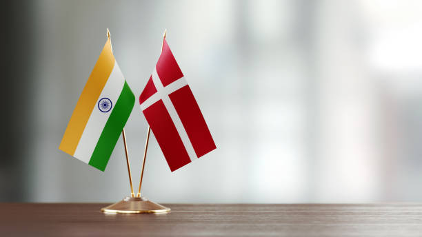 istock Indian And Danish Flag Pair On A Desk Over Defocused Background 925492340