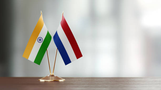 istock Indian And Dutch Flag Pair On A Desk Over Defocused Background 925493274