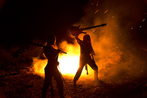Duo performing music and dance by a fire in Sonoma County, California.