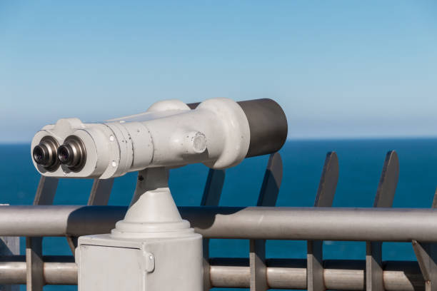 istock White binoculars staring at clear blue sea horizon 925494936