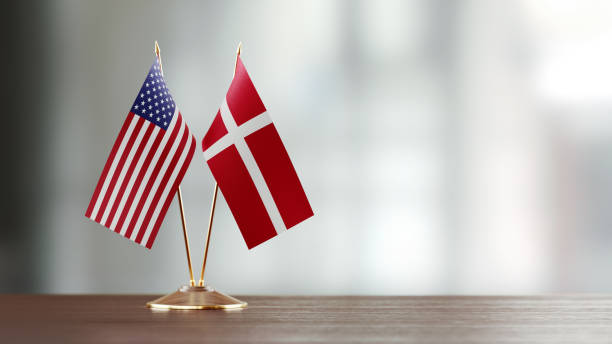 istock American And Danish Flag Pair On A Desk Over Defocused Background 925497142