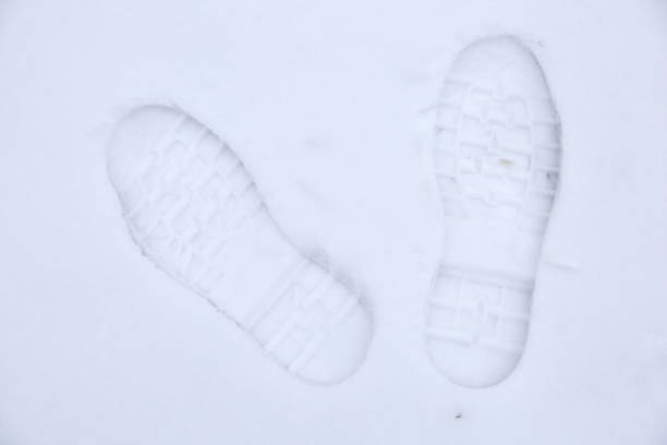 istock Footprints of shoes on fresh snow. 925498042