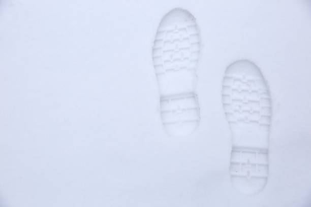 istock Footprints of shoes on fresh snow. 925498356