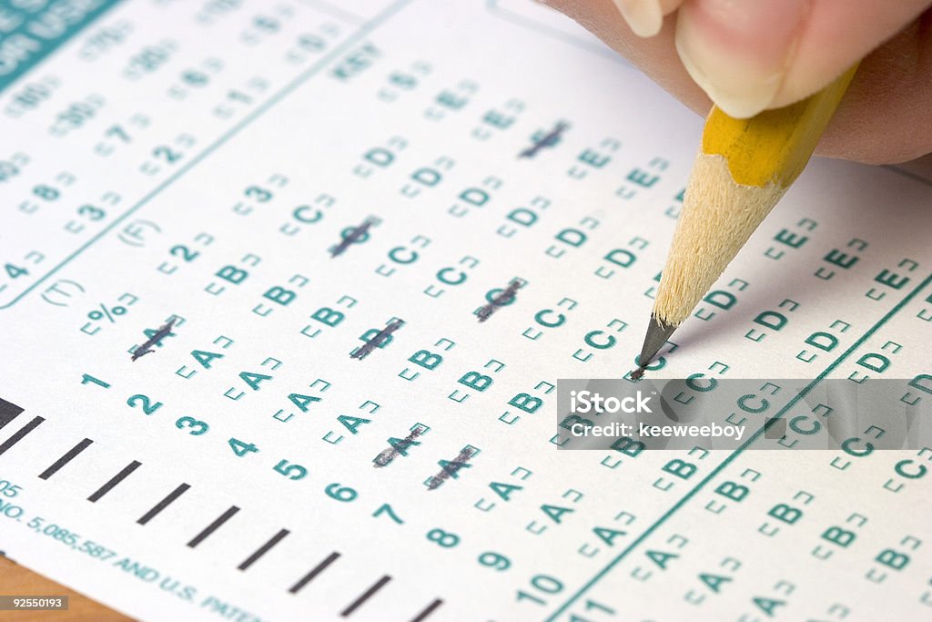 A student taking a test on a green form Test Color Image Stock Photo