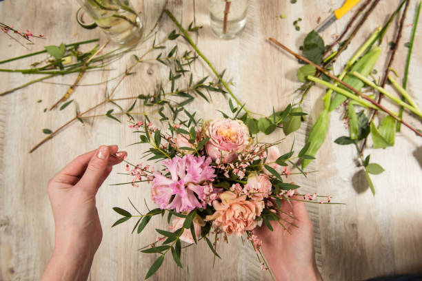 Flower pink and pastel composition in female hands