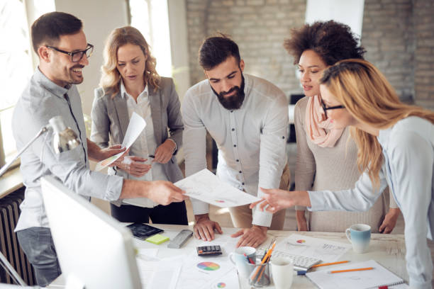 istock Group of business people working on project in modern office 925504458