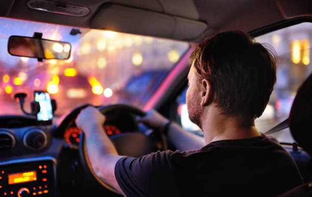 istock Male driver ride a car during evening traffic jam 925511740