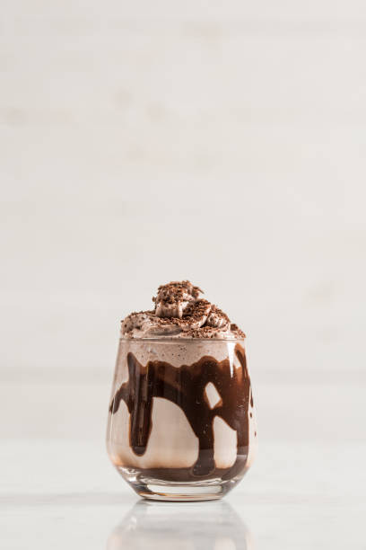 istock Chocolate Milk and Whipped Cream on White Background 925515510