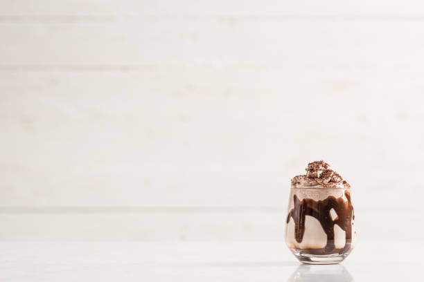 istock Chocolate Milk and Whipped Cream on White Background 925515536