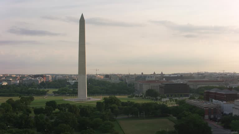 Aerial sunrise view of Washington Monument and White House.