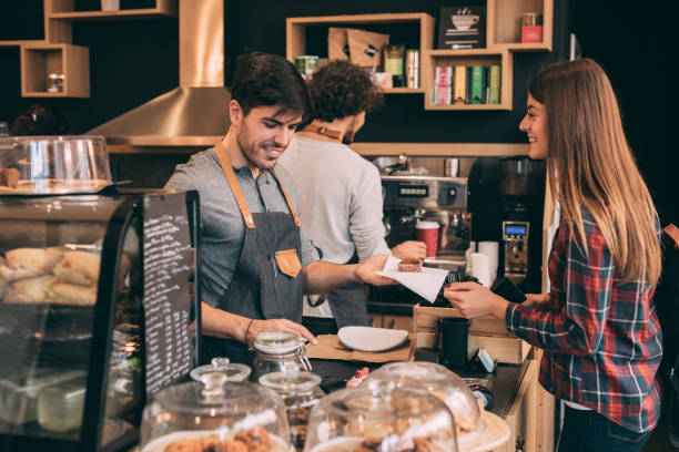 istock Customer buying muffins at a coffee shop. 925516610