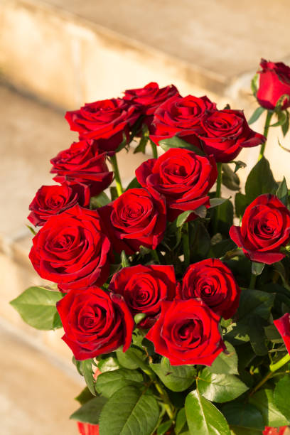 istock bouquet of blossoming dark red roses 925517666