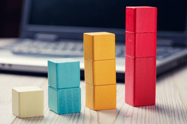istock building blocks cubes against blur laptop background 925525000