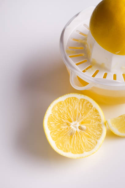 istock Lemon and juice on a white background 925525158