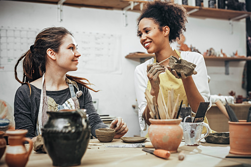 Female potters  in art studio