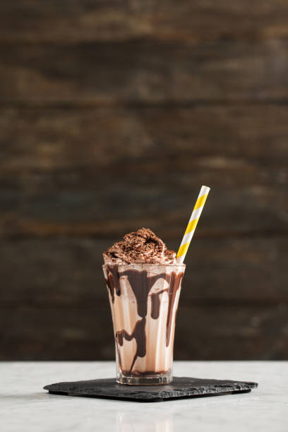 istock Chocolate Milk and Whipped Cream on Wooden Background 925528280
