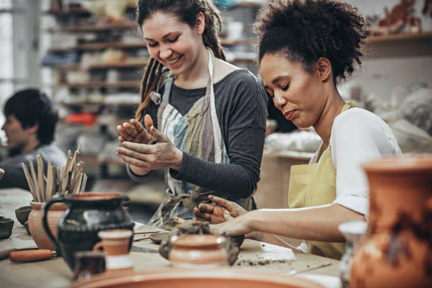 istock Female potters  in art studio 925528390