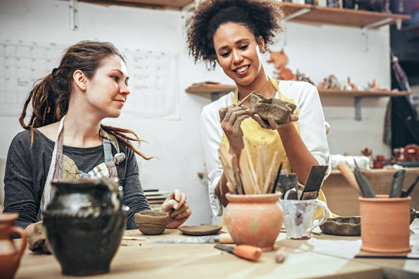 istock Female potters  in art studio 925528720