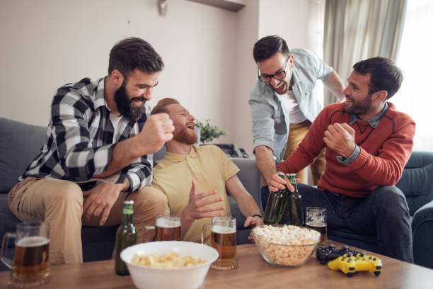 istock Friends playing video games at home 925533520