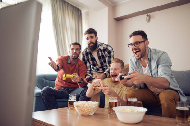 istock Friends playing video games at home 925533570