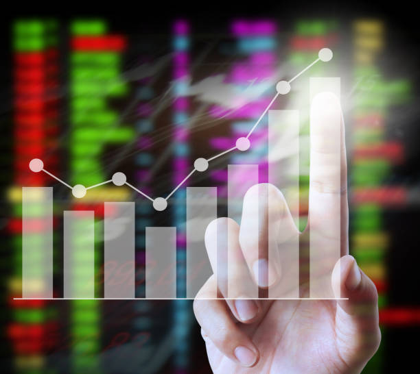 istock financial symbols coming from hand 925535534