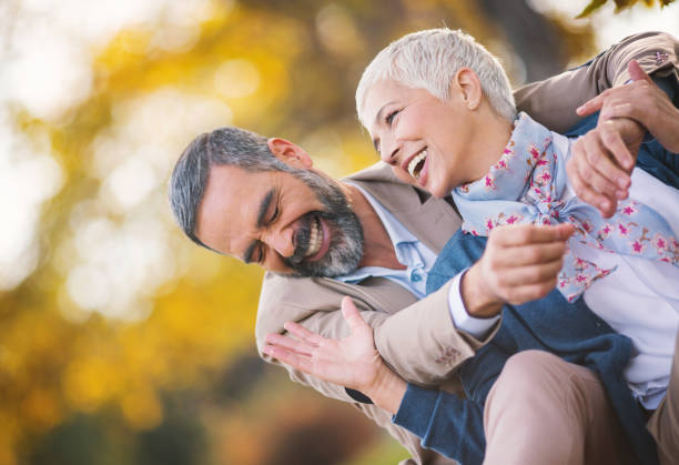 istock Mid aged couple in a park 925548850